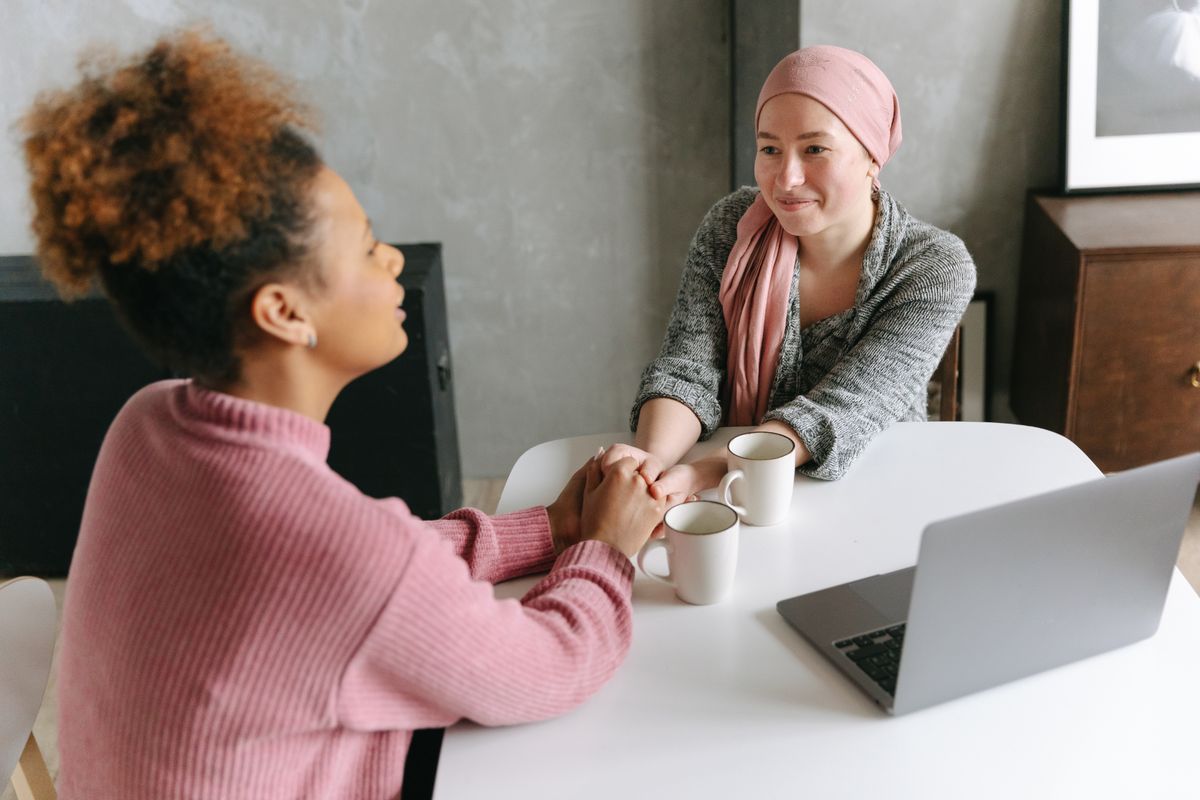 Two people in a warm, supportive conversation
